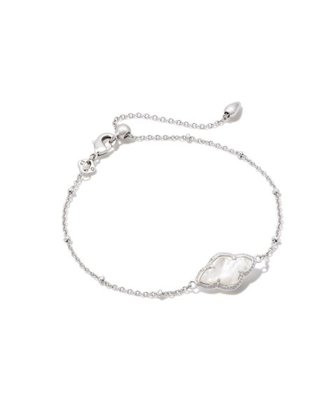 Our iconic medallion—representing joy, optimism, possibility, and femininity—gets reimagined in the Abbie Silver Satellite Chain Bracelet in Ivory Mother-of-Pearl. With its elegant and elongated stone and subtle satellite chain detailing, it’ll be the perfect addition to your bracelet stack.,MetalRhodium Over BrassMaterialIvory Mother-Of-PearlClosureLobster claspSize8L, 0.41WDue to the one-of-a-kind nature of the medium, exact colors and patterns may vary slightly from the image shown.} | Kendra Silver Preppy Jewelry, Silver Bracelet Aesthetic, Classy Jewelry Silver, Pretty Silver Jewelry, Pearl Jewelry Silver, Silver Bracelet Stack, Kendra Scott Bracelet, Silver Jewlery, Preppy Jewelry