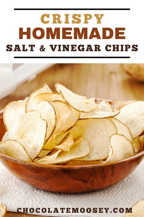 Crispy Homemade Salt & Vinegar Chips from scratch taste just like store-bought chips with their lip-smacking flavor thanks to one secret ingredient. Learn how to make baked salt and vinegar chips as well as frying them. Once they’re done cooking, let your chips cool in a single layer for a few minutes. If you pile them on top of each other, they may get soggy from the heat. How To Make Salt And Vinegar Chips, Salt Vinegar Chips, Salt And Vinegar Chips Air Fryer, Baked Potato Chips In Oven, Homemade Chips In Oven, Salt And Vinegar Chips Recipe, Homemade Salt And Vinegar Chips, Lays Baked Chips, Oven Potato Chips