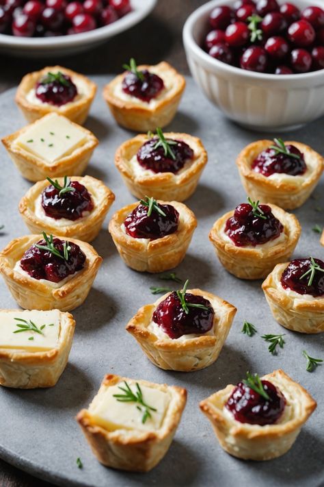 A photo of a  Cranberry Brie Bites which is a type of thanksgiving appetizers Fancy Fall Appetizers For Party, Brie Appetizer Thanksgiving, Stuffing Bites Appetizers, Easy Christmas Orderves, Holiday Party Small Bites, Mini Brie Appetizer, Thanksgiving Cold Appetizers, Thanksgiving Brie Recipes, Elevated Thanksgiving Recipes