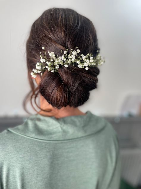 Bridesmaid low textured updo with flowers Updo Hairstyles Indian Wedding, Indian Bridal Updo With Flowers, Flower Hair Bun Indian Wedding, Weddings Hairstyles Indian, Bun Hairstyle With Flower, Low Updo Wedding Hair With Flowers, Low Bun With Flowers Indian, Bun Hairdo Indian Wedding, Indian Bride Updo Hairstyle