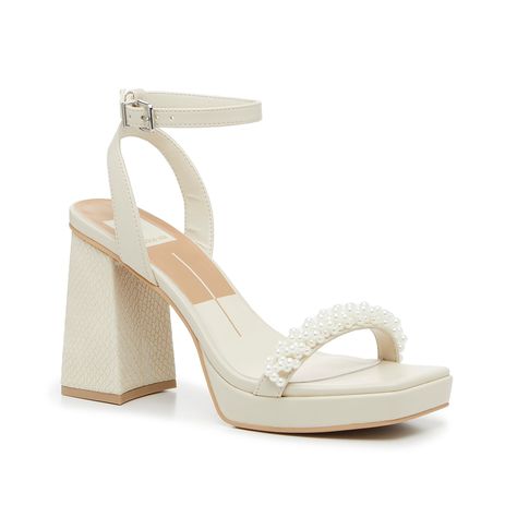 Dolce Vita-Alesia Sandal From bridal showers to brunch, the Alesia sandal adds a stylish touch to any look. This two-piece pair from Dolce Vita is complete with a subtle snake print heel, faux pearls along the strap, and a modern squared off toe detail. Complete with a delicate ankle strap to keep your steps secure. Ivory Pearl Heels, Dolce Vita Pearl Heels, Beach Wedding Heels, Pearl Strap Heels, Wedding After Party Shoes, Boho Wedding Heels, Cute Hoco Heels, Pearl Wedding Heels, Wedding Shoes Affordable