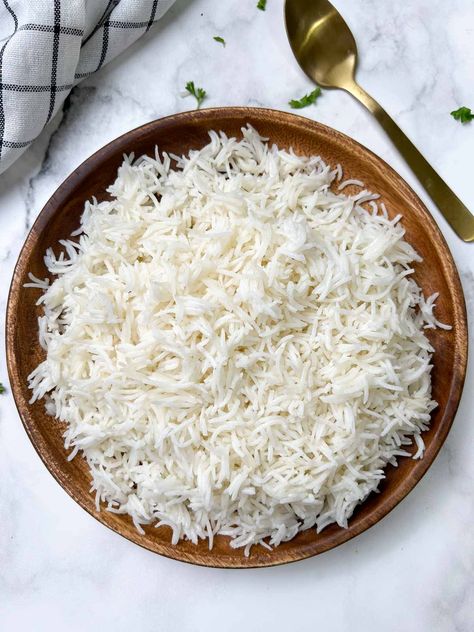 cooked white basmati rice on a plate with spoon on the side Basmati Rice In Instant Pot, Instant Pot Basmati Rice, Rice In Instant Pot, White Basmati Rice, How To Reheat Rice, Basmati Rice Recipes, White Rice Recipes, Chicken Curry Salad, Poached Chicken