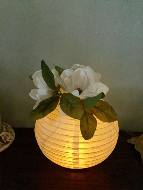 We used paper lanterns with a LED  tea light for centerpiece's at our class reunion. We hot glued a wide mouth bell jar lid on the bottom for a base so it would stand on the table. We used silk magnolias on the top to fill the hole. Paper Lantern Centerpieces, Diy Paper Lanterns, Tiana Birthday Party, Centerpieces For Weddings, Class Reunion Decorations, Reunion Decorations, Paper Lanterns Diy, Deco Champetre, Lantern Centerpieces