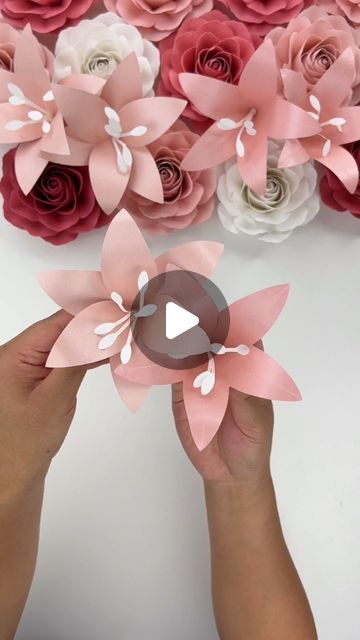 Hey, I’m Judy 👋🏻 Paper Flower Art + Tutorials on Instagram: "Here is the tutorial for my Mini Lily Template - there are two “designs” included mainly because I couldn’t pick one I liked most (and I figured anyone who wanted the template would like the two options).   The template uses very little paper per flower and I think these would be great to fill in gaps in paper flower bouquets or displays!   For paper, I used the two pink shimmer cardstock pack from @michaelsstores and I also used @bearlyarts glue for design 2. Using craft glue allows for more flexibility in the petal for shaping.   The Mini Lily Template is available in my Etsy shop, link in bio! I will also put a link in my stories and it will be saved to my “tutorial” highlights.  #paperflowers #lilies #cricut #cricutmade #te How To Make Lily Flower With Paper, Paper Lily Flower, Lily Template, Tiny Paper Flowers, Paper Flower Bouquet Tutorial, Cardstock Paper Crafts, Lilium Flower, Paper Flower Bouquets, Paper Lily