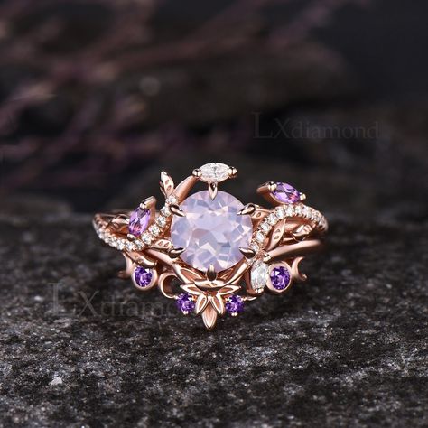 Item description ✦ Handmade, high-quality item! ✦ Material: 925 sterling silver, Solid 10k/14K/18K GOLD (can be made in white/rose/yellow gold) Engagement ring ✦ Center stone: Natural Lavender Amethyst. ✦ Size/Weight: 7mm Round Cut ✦ Side stones: Marquise Cut Natural Amethyst and Marquise Cut/Round Cut Moissanites Wedding band ✦ Gemstones: Round Cut Natural Amethyst Any ring size can be made,if the ring size is not in the option list ,contact me. As it is handmade,it needs 2-4 weeks to finish and then be shipped by usps or DHL. Return policy: We offer 30 days return policy. For any reason, if you are not completely satisfied with your order, you may return it for a refund.  Buyer is responsible for the handcraft fee (15%-30% of the total price) and the return shipping cost. Amethyst Gemstone Jewelry, Rose Gold Gemstone Ring, Rings Engagement Purple, Amethyst Engagement Ring Gold, Amethyst Engagement Rings, Purple Wedding Rings, Fantasy Rings, Amethyst Wedding Ring, Amethyst Rings