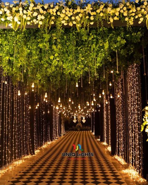 Naushad Khan on Instagram: "Taking our guests on a fairytale ✨ experience as they step into a pathway overflowing with hundreds of sparkly fairy-lights ✨✨✨✨✨ : : Light designing by: @uniq_lights : : Visit us: www.uniqlights.com : Facebook : Uniq lights You tube : Uniq lights Email@: info@uniqlights.com : : : : #wedding #bride #love #weddingphotography #uniqlights #weddingday #weddinginspiration #photography #fashion #weddingplanner #makeup #bridetobe #bridal #prewedding #weddingphotographer #w Lights Entrance Wedding, Light Decoration For Wedding, Fairy Lights Entrance Decor Wedding, Lighted Pathway Wedding, Lawn Stage Decoration, Outside Indian Wedding, Wedding Tunnel Entrance Fairy Lights, Wedding Lights Decorations, Open Lawn Wedding Decoration