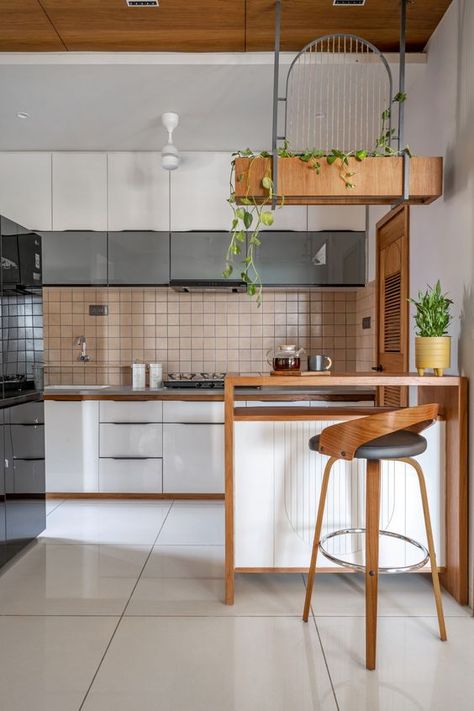 This 1,200-square-foot Ahmedabad home is an ode to subtle whimsy | Architectural Digest India Animation Office, Breakfast Counter, Crockery Unit Design, Paint Kitchen Cabinets, Open Kitchen And Living Room, Crockery Unit, Living Tv, Paint Kitchen, Kitchen Interior Design Decor