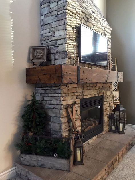 Before and after photos of a Custom Wrap Around Fireplace Mantel that I made and then installed in Herriman, Utah. Some details about the job:  The mantel was made from an Alder beam over 10 feet wide. I used straps to hide the extension beyond 10 feet because knotty alder only comes in 10 feet lengths It was actually made and installed in 3 pieces.  I created a custom stain for the Mantel to match the home’s furniture.  Final Measurements: 14 Feet Wide 12 Inches Deep 11.5 Inches Tall Wrap Around Fireplace, Rustic Farmhouse Fireplace, Fireplace Redo, Rustic Fireplace Mantels, Cabin Fireplace, Mantel Fireplace, Brick Fireplace Makeover, Rock Fireplaces, Farmhouse Fireplace