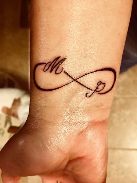 Infinity sign with initials.  Wrist tattoo. Infinity Sign With Initials Tattoo, Infinity Tattoo On Finger With Letter, Mp Tattoo Letter Design, Small Infinity Tattoos With Initials, Tattoo Ideas Infinity Signs, Infinity Tattoo With Initials, Infinity Tattoo For Men, Mp Tattoo, Wrist Tattoos Quotes