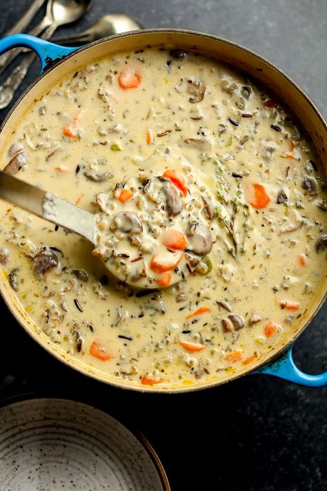 Soup Season is my favorite season, and THIS one tops them all. Creamy Mushroom Wild Rice Soup with Mushrooms has all the good stuff - wild rice, plenty of veggies, and a creamy roux to bring it all together! Cheesy Wild Rice Soup Taste Of Home, Minnesota Wild Rice And Mushroom Soup, Mushroom Soup Wild Rice, Wild Rice Cream Of Mushroom Soup, Mushroom Thyme Soup, Beef Mushroom Wild Rice Soup, Cream Of Mushroom Wild Rice Soup, Cheesy Mushroom Soup, Mushroom Soup With Wild Rice