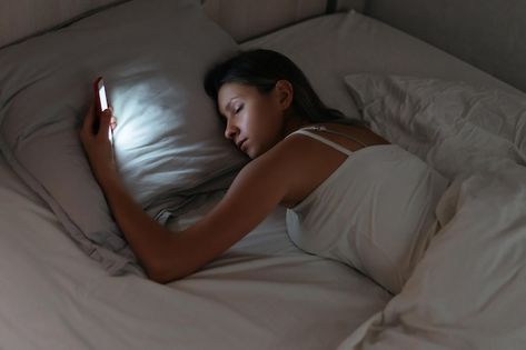 Sleeping woman is holding smartphone in ... | Premium Photo #Freepik #photo #texting #phone-addiction #using-phone #watching-phone Sleeping Woman, Pale Pink Peonies, Snoring Remedies, Sleeping Women, Laying In Bed, Trying To Sleep, Outdoor Photoshoot, Yellow Walls, Exeter