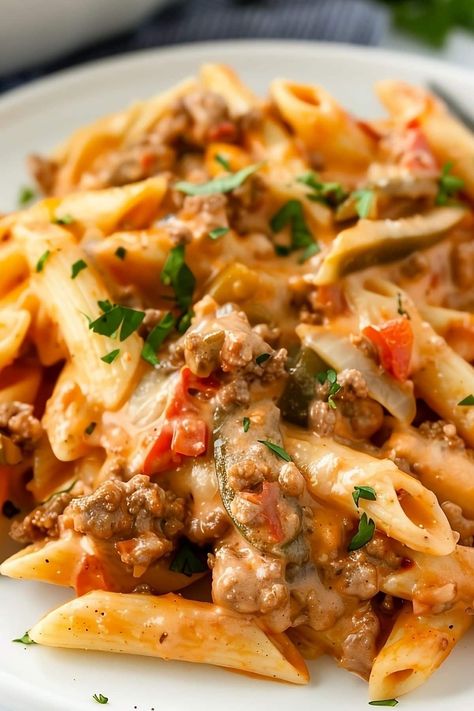 This Rotel pasta is creamy, dreamy, and full of delicious flavor! The combo of ground beef and Rotel tomatoes in a melty cream cheese sauce is divine. Creamy Sausage Rotel Pasta, Creamy Ground Beef Noodle Casserole, Supper Ideas With Noodles, Large Easy Meals, Hamburger Easy Dinner Recipes, Beef And Rotel Recipes, Meals With Ground Beef And Pasta, Healthy Dinner Recipes Beef Ground, Pasta Rotel Recipes