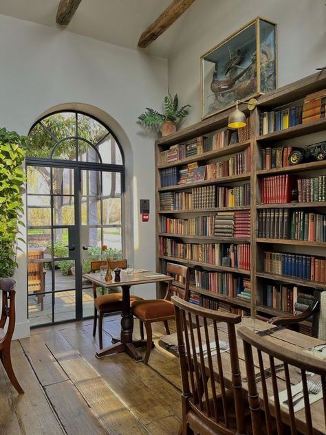 Bakery With Library, Literature Classroom Aesthetic, Mismatched Furniture Cafe, Coffeeshop Bookstore Aesthetic, Book Store Cafe Aesthetic, Coffee Book Shop Design, Bookstore With Cafe, Bookshop Coffee Shop, Cottagecore Cafe Interior