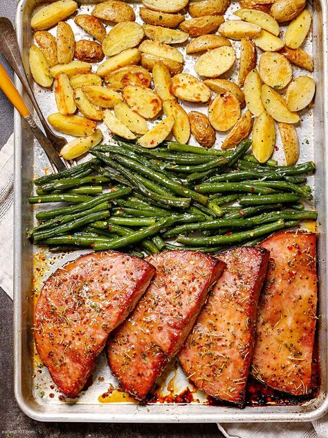 Ham Steaks Sheet Pan Dinner Recipe – How to Cook Ham Steaks — Eatwell101 Ham Steak Meal Ideas, Sliced Ham Recipes Dinners, Recipes Using Ham Steaks, What To Make With Ham Steak, Recipes With Ham Steak, Ham Steak In The Oven, Ham Steak Recipes Easy, Ham Steak Recipes Baked In Oven, Ham Slices Recipes Dinners