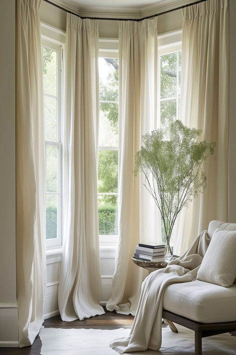 Serene bay window setting with flowing sheer linen curtains, bringing a calm and elegant feel to the room. Curtains For Living Room Windows, Window Treatments For Bay Windows, Bay Window In Living Room, Curtains Bay Window, Bay Window Curtain Ideas, Living Room With Bay Window, Bedroom Bay Window Ideas, Bay Window Dressing, Bay Window Decorating Ideas