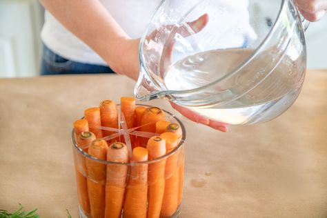 HOW TO CREATE A CUTE EASTER CARROT FLOWER ARRANGEMENT | Everyday Laura Carrot Decorations For Easter, Carrot Flower Arrangement, Carrot Decor, Mason Jar Flower Arrangements, Easter Centerpieces Diy, Carrot Flowers, Easter Flower Arrangements, Easter Arrangement, Easter Carrots