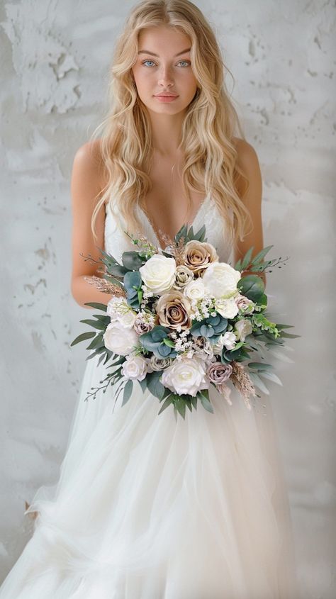 More beautiful wedding flowers https://bridalstoryus.etsy.com  Bridal wedding bouquet is created with high quality silk flowers. These handmade artificial wedding bouquets make beautiful additions to wedding and event floral arrangements. Flowers: peonies, roses, eucalyptus and fillers.  Colors: white, beige, taupe, green, white, pale champagne. Handle: wrapped in ivory satin ribbon. Size: bridal bouquet is approximately 14" wide, bridesmaids bouquet is 8". SUGGESTION: steaming the bouquets upon June Wedding Flowers, Bridesmaid Bouquet Alternatives, Tiana Wedding, Wedding Bouquet White, Bridal Bouquet White, Vintage Bridal Bouquet, Eucalyptus Wedding Bouquet, Rust Wedding, Green Wedding Bouquet