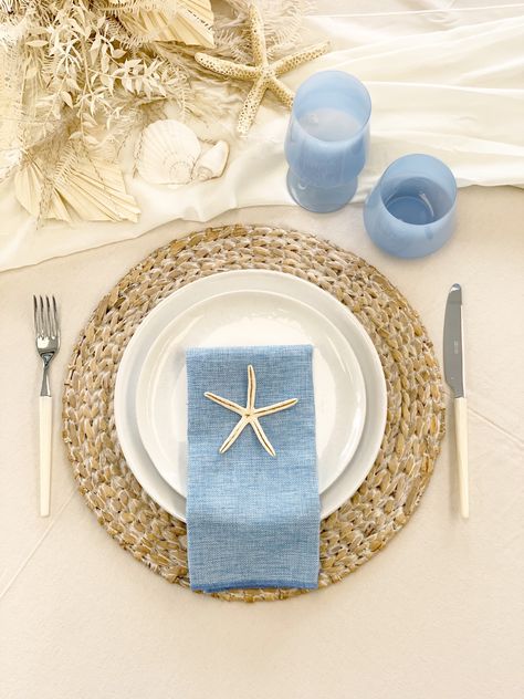 Perfect table setting for a coastal theme event. Coastal wedding ideas. Coastal Bridal shower. Coastal Beach theme party . Coastal baby shower ideas. Coastal Rehearsal Dinner Decor, Center Peice Ideas For Table, Boho Beach Theme Party, All I Sea Is Love Bridal Shower Theme, Coastal Bridal Shower Ideas, Coastal Picnic, Coastal Thanksgiving, Hibachi Party, Coastal Wedding Ideas