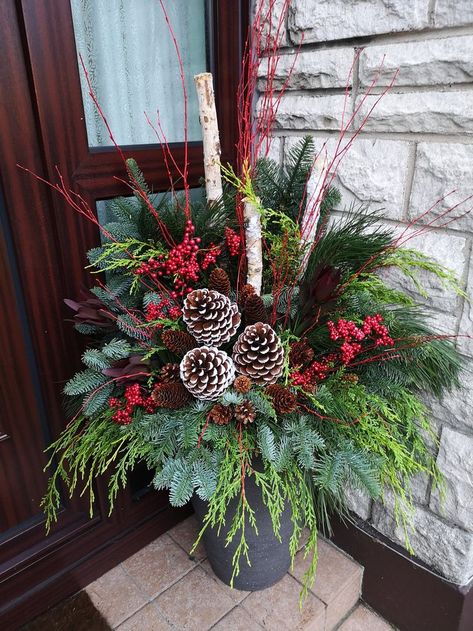 Diy Christmas Arrangements Front Porches, Diy Xmas Planters Outdoor, Christmas Greenery Planters, Outdoor Christmas Decorations For Porch Flower Pots, Porch Urns Christmas, Christmas Porch Planters Front Doors, How To Decorate Outdoor Flower Pots For Christmas, Christmas Potted Plants Outdoors, Porch Pots Ideas Christmas