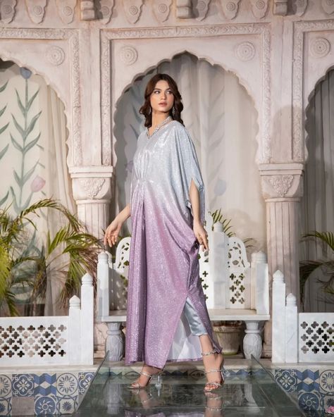 The MOONLIGHT - 2 Piece Kaftan is a must-have for any formal occasion. With its blingy design and sequence fabric, this kaftan is perfect for adding a touch of glamour to your evening look. Plus, it's perfect for night photography, making it a versatile and stylish choice. Fabric: Moonlight Includes: Kaftan and trousers  Length: 52"-53" Model's height: 5'8 ***PLACE YOUR PRE-ORDERS BY 29TH MARCH 2024 FOR GUARANTEED DELIVERY BY EID*** #readytowear #Pakistaniwedding #Pakistanibride #Moder... Moonlight Dress Design Pakistani, Maxi Designs Pakistani, New Kaftan Designs, Pakistani Bridesmaid Dresses, Latest Kaftan Designs, Kaftan Dress Modern, Eid Suits, Pakistani Bridesmaids, Sequence Fabric