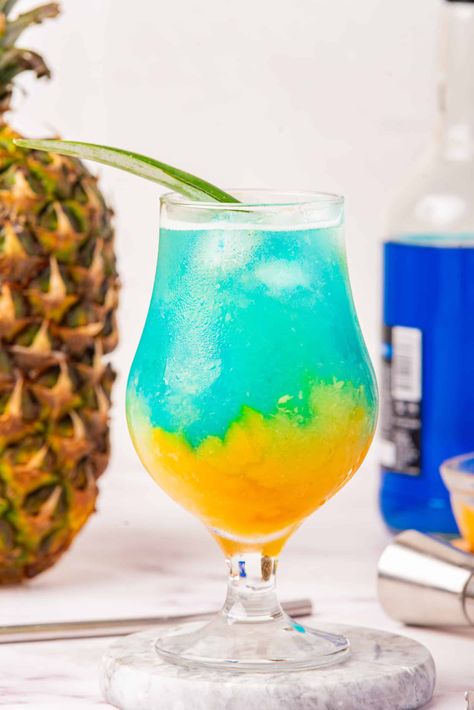 If you enjoy Tiki drinks this list is for you! These tropical cocktails are perfect for a hot day or anytime you want to enjoy a tasty drink. From classic Mai Tai to Rum Punch and more! Get the recipes for the best alcoholic tiki drinks to make with simple ingredients. Cheddar Recipes, Cocktails To Make At Home, Seasonal Cocktails, Tiki Drink, Passion Fruit Syrup, Layered Drinks, Famous Drinks, Malibu Coconut, Breakfast Soup