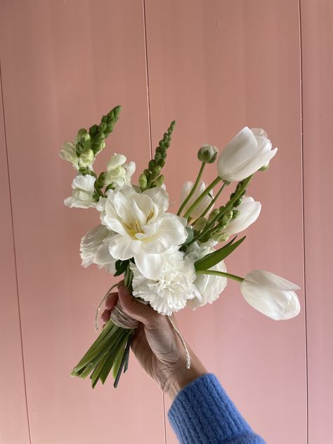 #white #bridal #bouquet #wedding #flowers #tulips #snapdragons #carnations White Tulips Bridesmaid Bouquet, Tulips In Wedding, Unique White Wedding Bouquet, Tulips Bridesmaid Bouquets, Mini Bridesmaid Bouquet White, White Carnations And Eucalyptus, Ranunculus Tulip Bouquet, White Poppy Wedding Flowers, Bridal Tulip Bouquet