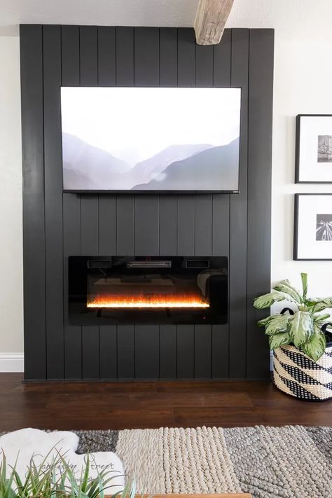 Tv On Black Wall Mounted Tv, Mantle And Electric Fireplace, Statement Wall With Electric Fireplace, Large Tv Over Electric Fireplace, Electric Fireplace Ideas Black, Electric Fireplace Concrete Wall, Electric Fireplace Black Wall, Vertical Shiplap Corner Fireplace, Small Living Room With Electric Fireplace