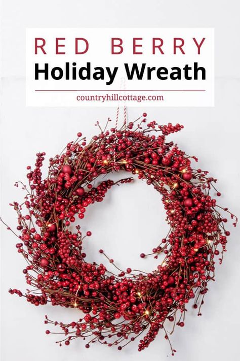 See how to make a DIY red berry wreath! Give guests a beautiful welcome with a large red berry wreath at your front door that spreads holiday spirit! This simple traditional holiday wreath with faux red berries would also be lovely Christmas decor for your fireplace mantle or on a mirror. The easy step-by-step tutorial also includes tips for showcasing and storing the wreath and ideas for variations like a frosted berry wreath and tips for working with real berries. | CountryHillCottage.com Christmas Reef, Holly Berry Wreath, Pip Berry Wreath, Valentine Wreath Diy, Red Berry Wreath, Red Christmas Wreath, Pretty Christmas Decorations, Holiday Wreaths Diy, Red Wreath