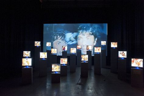 A sea of screens. Perhaps all playing back the performance at slightly different times? An overload of information. What do we actually take in? Projection Installation, Screen Installation, September Events, Nam June Paik, Exhibition Display Design, Tv Installation, New Media Art, Leonard Cohen, Interactive Installation