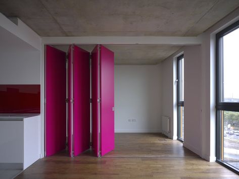 Retractable magenta wall - Trendir Ancoats Manchester, Magenta Walls, Moveable Wall, Accordion Doors, Moving Walls, Movable Walls, Sliding Wall, Micro Apartment, Room Partition