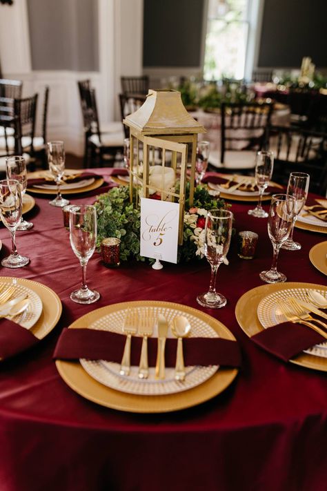 Venue: Richwood on the River | Burgundy wedding table setting; gold accents; burgundy and gold wedding; centerpieces. Burgundy Cream And Gold Wedding Decor, Terracotta Burgundy Gold Wedding, Maroon White Gold Wedding, Burgundy Gold Table Setting, Cabernet And Gold Wedding, Burgandy Wedding Centerpieces, Red White And Gold Wedding Centerpieces, Burgundy And Gold Decor, Burgundy And Gold Table Setting