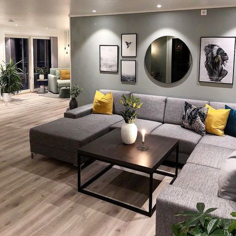 I like the arrangement of the picture frames and round mirror above the sofa. Mirrors Above Couch, Above Couch Decor, Wall Mirror Decor Living Room, Couch Wall Decor, Mirror Decor Living Room, Sofa Wall, Above Couch, Grey Couches, Gallery Wall Living Room