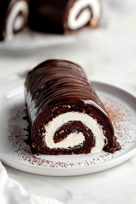 Chocolate Swiss roll cake is a decadent delight, combining rich, moist chocolate sponge cake with a velvety, creamy filling. Each bite offers a perfect balance of cocoa flavor and smooth sweetness. Chocolate Swiss Roll Recipe, Swiss Cake, Chocolate Swiss Roll, Chocolate Roll Cake, Yule Log Cake, Swiss Roll Cake, Ganache Cake, Cake Roll Recipes, Postre Keto