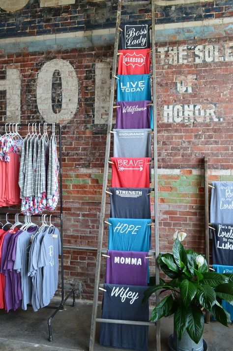 ladder t-shirt displays Boutique Store Front, Boutique Store Displays, T-shirt Display, Clothing Store Displays, Clothing Racks, Tshirt Display, Shirt Display, Boutique Display, Vendor Booth