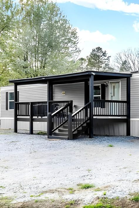 Mobile Home Charcoal Black Porch - Get inspired with these 10 vibrant and stylish color ideas for your mobile home porch! From bold blues to warm yellows, these colors will make your porch the envy of the neighborhood. Add some curb appeal and personality to your home! Yard Landscaping Mobile Home, Trailer Home Porch Ideas, Front Porch Ideas Trailer, Diy Trailer Porch Mobile Homes, White Manufactured Home Exterior, Grey And Black Mobile Home Exterior, Front Porch Trailer Home, Back Porch For Mobile Home, Front Porch Diy Makeover