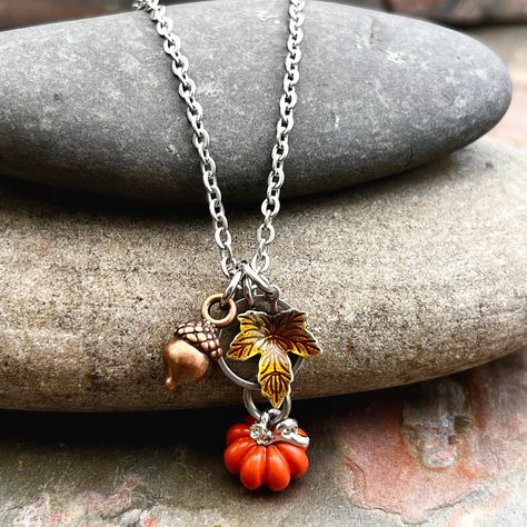 Pumpkin Fall Handmade Necklace - Fall Lover Jewelry This fall lovers necklace is a great addition to your fall wardrobe!  It comes with all charms as shown, and the pumpkin charm has been dipped in a clear coating for extra protection while wearing.   Available in many chain lengths. INSTRUCTIONS for additional questions:  1.  Email photos to touchofwhimsybyjen@yahoo.com 2.  Private msg on Facebook page at https://www.facebook.com/touchofwhimsybyjen/ 3.  Send through message on Etsy messenger ** Halloween Jewelry Diy, Pumpkin Jewelry, Fall Lovers, Pumpkin Necklace, Goth Clothes, Fall Rings, Beads Craft Jewelry, Autumn Necklace, Lover Jewelry