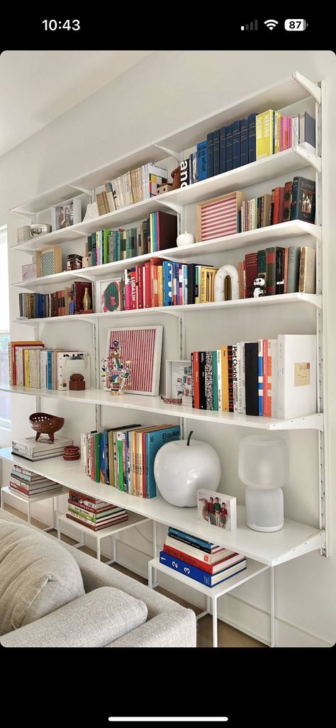 Elfa Shelving Living Room, Elfa Shelving Office, Shelving Behind Sofa, Build In Bookshelf, Track Shelving Ideas, Collectible Display Ideas, Irregular Shelves, Bookshelf Layout, Modern Book Shelf