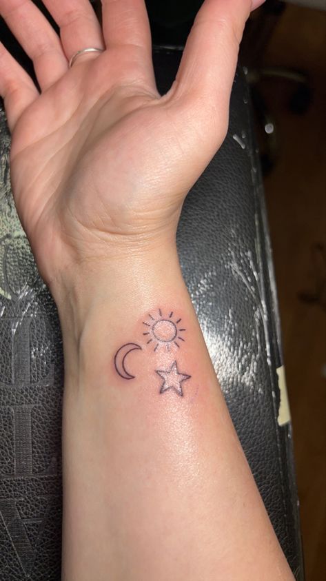 Wrist Stars Tattoo, Sun Moon And Star Tattoo, Foot Tattoo Ideas Female, Female Foot Tattoos, Tattoo Ideas Female Foot, Sun Moon Star Tattoo, Sun Moon Stars Tattoo, Moon Tattoo Wrist, Moon And Star Tattoo