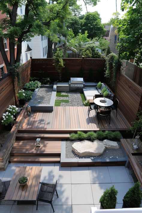 Modern backyard with wooden decking, seating area with green cushions, dining table, grill, and lush landscaping featuring trees and plants. Backyard Exterior Design, Modern Terraced Landscaping, Garden Contemporary Design, Modern Trex Deck Ideas, Modern Deck Design Backyards, Backyard Patio Designs Modern, Modern Backyard Patio Designs, Outside Landscape Ideas, Uneven Backyard Ideas Sloped Yard Patio