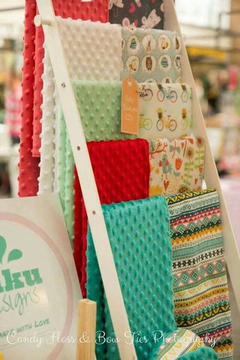 Baby blankets craft display. Blanket Display Ideas, Remove Grass Stains, Craft Fair Booth, Show Ideas, Craft Fair Booth Display, Scarf Display, Stall Display, Craft Show Booths, Craft Show Booth