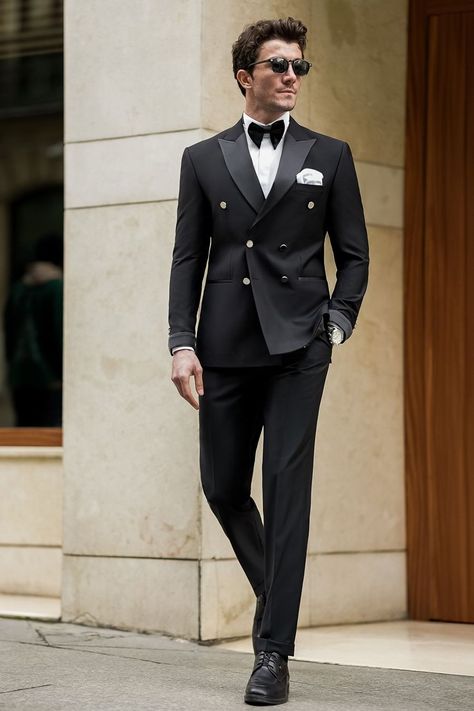 Our Black Tuxedo, crafted with meticulous attention to detail, this ensemble boasts a double-breasted jacket adorned with sleek satin lapels and subtle, modern touches. Paired with impeccably tailored trousers. Whether you're commanding the boardroom or stealing the show at a high-profile event, this tuxedo ensures you exude confidence.  #singlebreasted #suit #suits #slimfit #menstyle #menfashion #fashioninspo #formalwear #menclothing #formalattire #tuxedo #tuxedos #blacktuxedo Black Tuxedo Suit For Men, Double Breasted Black Tuxedo, Fashion Suits For Men Classy, Men’s Tuxedo Style, Tuxedo Designs For Men, Men Tuxedo Styles, Designer Tuxedo For Men, Formal Suits Men Wedding, Double Breasted Suit Men Classy