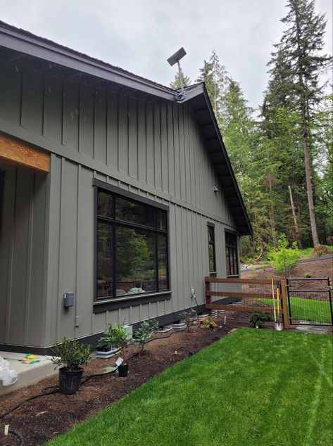 Board And Batten Gray Exterior, Ranch Style House Interior Makeover, Dark Colors For House Exterior, Evergreen Siding House, Modern House Green Exterior, Painted Brick House Exterior Colors Green, Ranch Colors Exterior, Exterior Siding Paint Colors, Small Farmhouse Exterior Colors