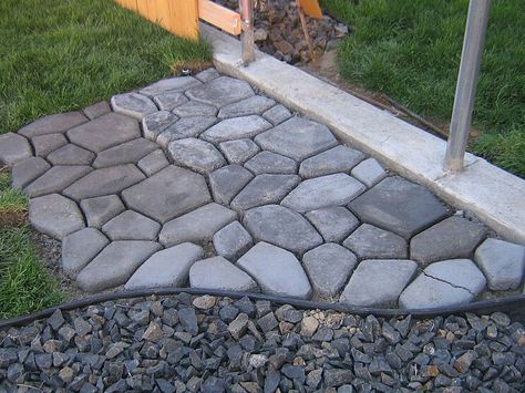 Concrete Cobblestone Path  We wanted to find something unique to use for our pathway and patio. We couldn't find anything we really liked. When I came across this concrete form from Lowes I was so excited. Not only does it look great but it was very cost effective.  To learn how we did it visit my blog at http://www.tancamjenksfam.blogspot.com/2011/... Diy Path, Stone Garden Paths, Concrete Path, Patio Pergola, Concrete Paving, Garden Paving, Stone Path, Cool Art Projects, Foto Tips