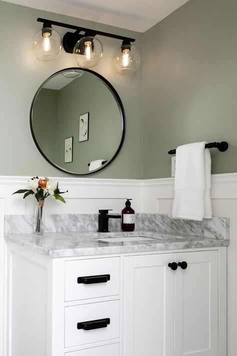 Sage Bathroom Ideas Paint, Green And White Powder Room, Sage Green Restroom Decor, Light Green Restroom Ideas, Sage Restroom, White Paneling Bathroom, Sage Green Bathroom With Gold Accents, Bathroom Remodel Green Walls, Farmhouse Bathroom Sage Green