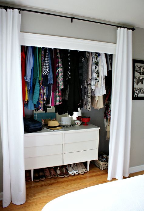 If you hang your closet's rod above eye level, you can slip in a sturdy (and stylish) dresser underneath. Curtains For Closet Doors, Ideas Armario, Organiser Son Dressing, Smart Closet, Dresser In Closet, Organized Closet, Closet Curtains, Reach In Closet, Open Closet