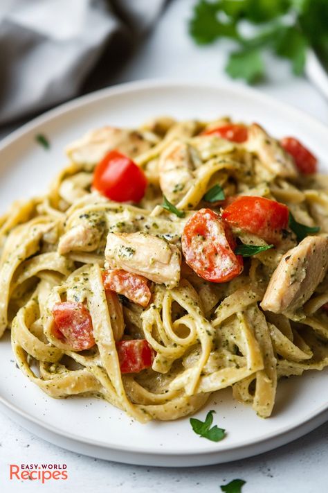 Creamy Chicken Pesto Pasta is a quick and easy dinner recipe combining tender chicken, al dente pasta, and a rich, velvety basil pesto sauce. Quick Pesto Pasta, Basil Pesto Chicken Pasta, Creamy Chicken Pesto Pasta, Chicken Basil Pasta, Pesto Pasta Recipes Chicken, Basil Pesto Chicken, Basil Pesto Recipe, Chicken Pesto Pasta, Creamy Pesto Chicken Pasta