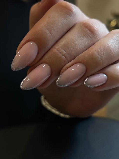 Almond Nails Sparkly French Tip, Minimalist Nails With Glitter, French Nails With Silver Tips, New Years Nails French Tip Almond, Christmas Nails Sparkly Silver Glitter, French Gliterry Nails, Nails With Glitter At Cuticle, Christmas Nails Glitter Tips, Glittery Tips Nails