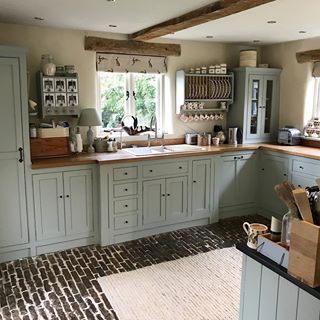 I love the sweet little windows in the back of the cottage and the mix of brick and flint, like so many cottages in Norfolk…