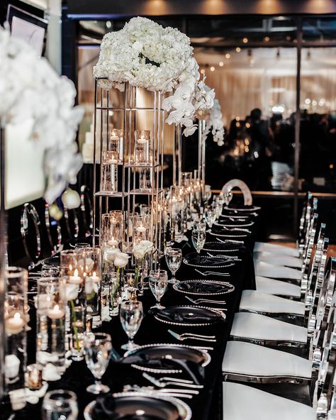 Black and white wedding reception with silver chairs and chargers Silver Wedding Decorations Receptions, White And Silver Wedding Decorations, Black White And Silver Wedding, Black Tie Wedding Decor, Black Tie Wedding Reception, Silver Wedding Reception, White Tie Wedding, Black Silver Wedding, Silver Wedding Theme