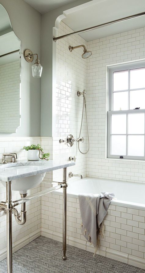 As in the master bath and powder room, the washstand in the daughter’s bathroom is by Waterworks. Tiles by Pratt & Larson line the walls, while Ann Sacks herringbone Carrara tiles cover the floor. White Subway Tile Bathroom, Makeover Kamar Mandi, Subway Tiles Bathroom, Interior Design Minimalist, 1920s House, Bad Inspiration, Small Remodel, Trendy Bathroom, Bath Room